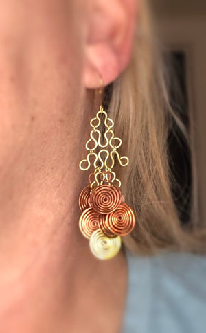 Bohemian style dangle earrings with spirals and geometric shapes